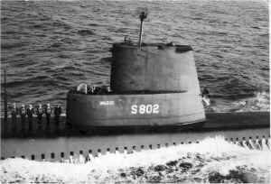 Ceremony commemorating Matroos 1e klasse A.C. van Dael. Feb 1955 Mediterranean Sea, off Sicily. Note the flag aft of the sail. (Photo: © Collection A de Keijzer).